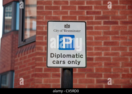 A City of Westminster parking sign for 'Diplomatic cars only' above a single parking bay on Eccleston Place, London, SW1, UK. Stock Photo