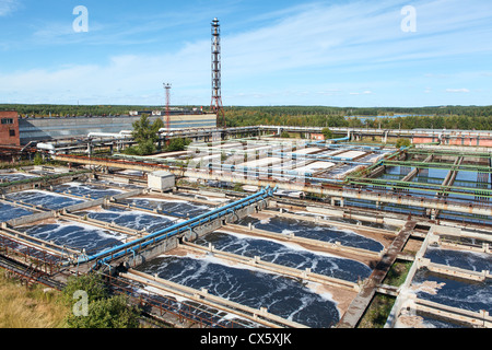 Aerial view of water treatment plant in evergreen woods. Water aeration on recycling tanks Stock Photo