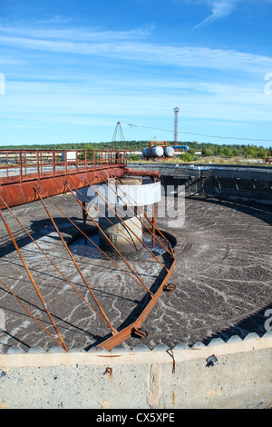Empty huge round form sedimentation settler tank in treatment plant Stock Photo