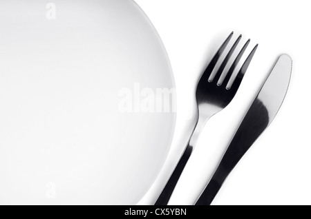 Empty plate with fork and knife on white background Stock Photo