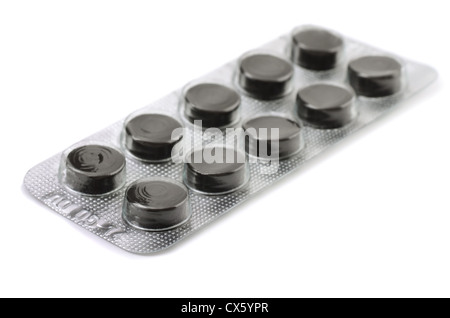 Activated charcoal pills in blister isolated on white Stock Photo