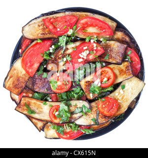 fried eggplants with red tomato and garlic on plate isolated with white background Stock Photo