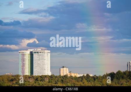 autumn rainbow under city park in blue sky Stock Photo