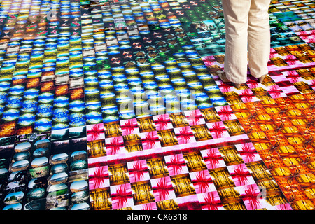 Photokina, worlds leading imaging fair, trade show for photography. Big installation of Lomography photos on the floor. Stock Photo