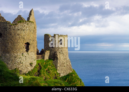 Dunluce Castle is a now-ruined medieval castle in Northern Ireland. It is located on the edge of a basalt outcropping in County Stock Photo