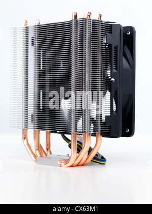 Closeup of computer processor cooler with a heat sink and a fan isolated on white background Stock Photo