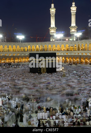 Pilgrims circumambulate the Kaaba at Masjidil Haram on February 2010 in Makkah, Saudi Arabia. Stock Photo