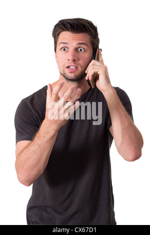 Young Man Talking On The Phone And Very Angry Stock Photo