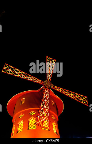 The famous windmill of the Moulin Rouge in Paris France at night Stock Photo