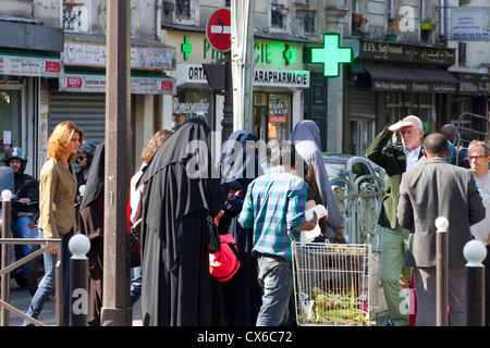 burka wearing muslim women in paris, france Stock Photo
