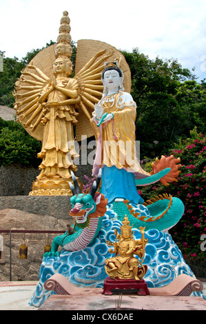 Female deities golden figures Khao Takiab Buddhist temple Hua Hin Thailand Stock Photo