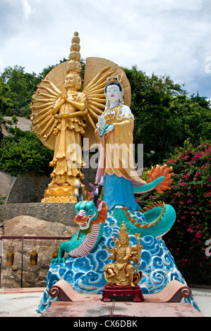 Female deities golden figures Khao Takiab Buddhist temple Hua Hin Thailand Stock Photo