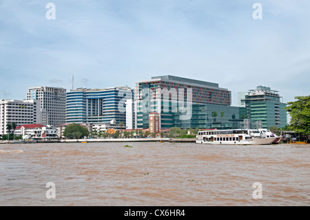 Traffic on the Chao Phraya River and Bangkok skyline Thailand Stock Photo