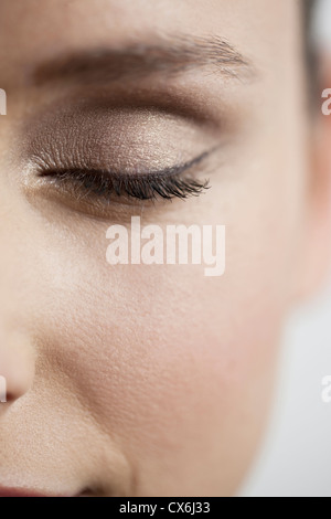 Close up of a young womans eye, closed Stock Photo