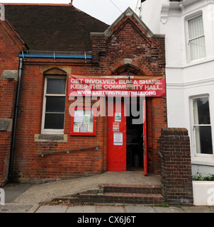 Local residents at the THEHALLGETINVOLVED Campaign to save the Exeter Street Hall in Brighton offer shares for sale UK Stock Photo