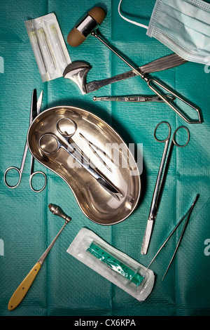 Various surgical instruments on a surgical drape Stock Photo