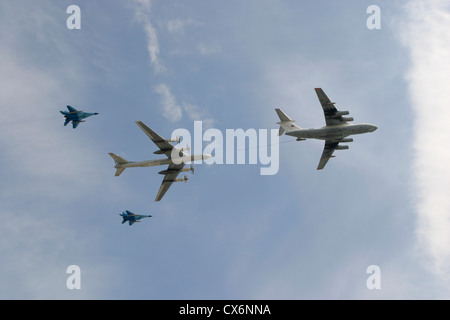 Russian military planes, including an Il-78 aerial refueling tanker, a Tu-95MS and two MiG-29, passing over Red Square in Moscow Stock Photo