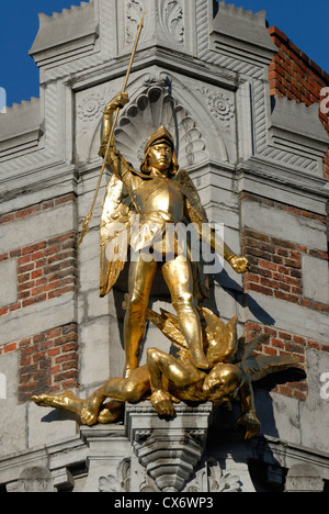 Brussels, Belgium. Golden statue of St Michael slaying Satan in Grand Place Stock Photo