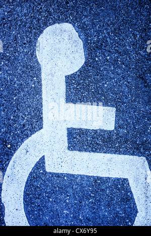 Parking space with handicap symbol painted on the asphalt Stock Photo