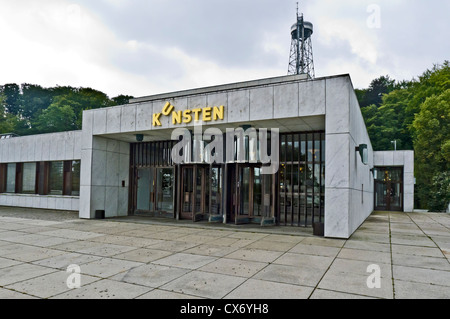 Kunsten Museum of Modern Art in Aalborg Denmark with Aalborgtaarnet (The Aalborg Tower) in the background Stock Photo