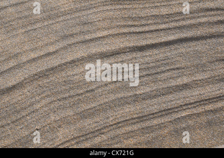 Rippled sand / fluvial ridges on beach / shoreline after tide has just retreated. Perranporth beach, Cornwall. Mars-like flow patterns concept. Stock Photo