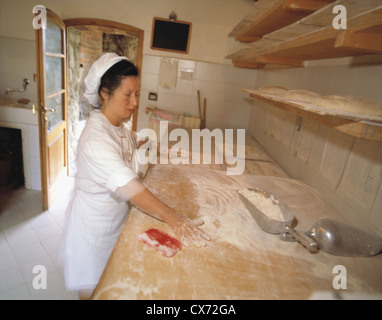 Still Fattoria La Vialla: Cook spreading flour Stock Photo