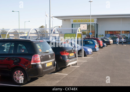 out of town shop shops shopping center centre centers centres car cars parking parked parking space spaces morrisons supermarket Stock Photo