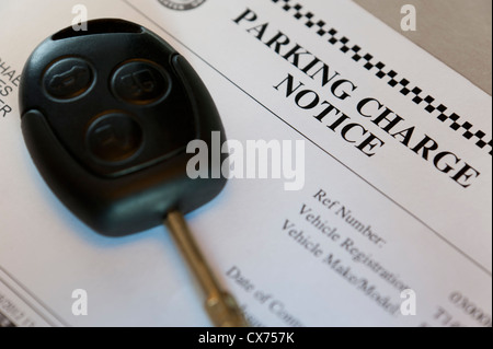 Parking Charge Notice with a car key Stock Photo