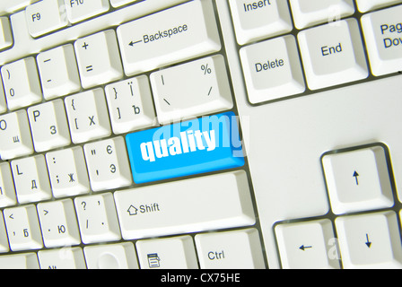A keyboard with blue button of quality Stock Photo
