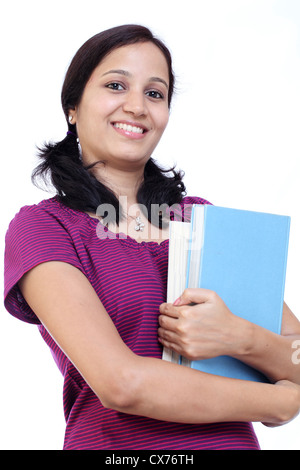 Portrait of Indian college student holding books in her hand Stock Photo