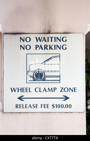 No parking, wheel clamping warning sign Stock Photo