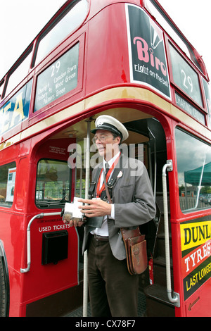 London bus conductor Stock Photo - Alamy