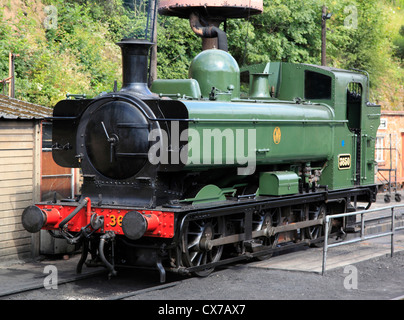 A GWR Pannier-tank 0-6-0 locomotive, no. 3650 draws a short passenger ...