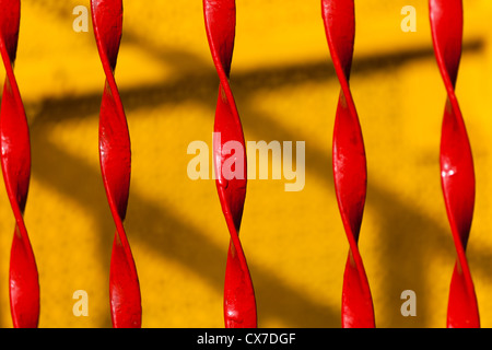 Red Twisted Iron Fence close up Stock Photo