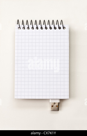 A spiral notepad with USB connector imitating a USB stick Stock Photo