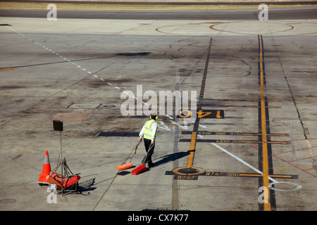 Ground crew preparing for jet landing Stock Photo