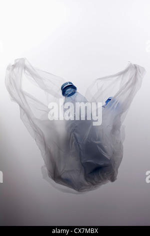 A plastic bag with two empty plastic water bottles Stock Photo
