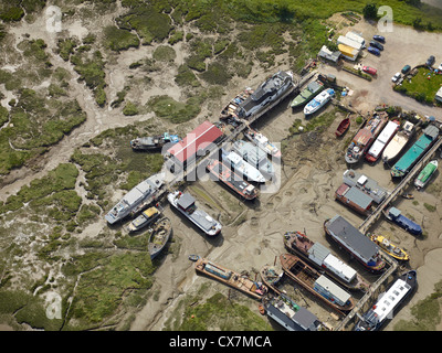 House boats at low tide on the  river Medway, Strood, Chatham, Kent, south east England Stock Photo