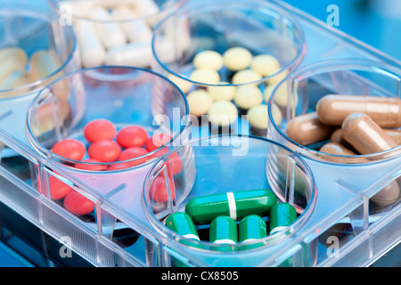 color pills and capsules in plastic tray Stock Photo
