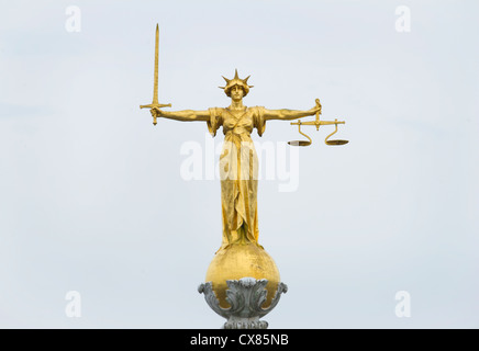 The gold bronze Lady Justice statue with sword and scales above the Central Criminal Court, Old Bailey, London Stock Photo