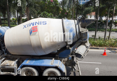 A mobile cement mixer truck on the streets of Singapore. We were in a vehicle just next to this mixer and the mixer was rotating Stock Photo