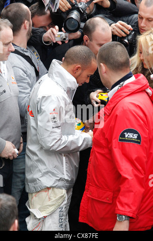 Mclaren Formula One racing driver Lewis Hamilton signing autographs Stock Photo