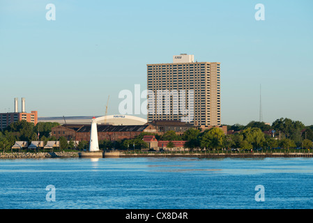 Michigan, Detroit. Early morning city skyline view of downtown Detroit from the Detroit River. Ford Field & lighthouse. Stock Photo