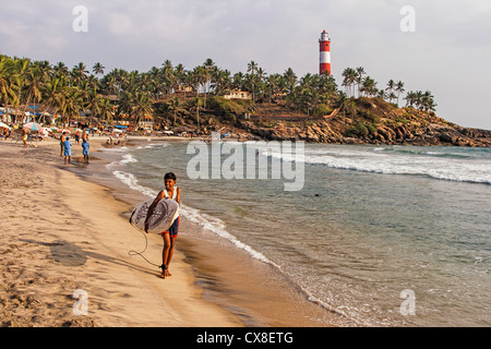 Kovallam beach, Surfer, lighthouse, India Kerala Stock Photo