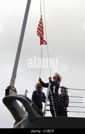 GALVESTON, Texas (Sept. 17, 2012) Sailors raise the Navy Jack aboard the Freedom-class littoral combat ship Pre-Commissioning Unit (PCU) Fort Worth (LCS 3) as the ship arrives in Galveston, Texas, for her commissioning ceremony Sept. 22. Fort Worth will proceed to her homeport in San Diego following commissioning. Stock Photo