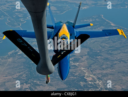 A KC-135 Stratotanker from Altus AFB refuels an Navy Blue Angel FA-18 Horne from Naval Air Station Pensacola, Fla., Sept. 20, 2012. The Blue Angels were refueled on the way to Grand Juction, Colo., to perform in the First Mountain West Airshow. Stock Photo