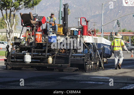 ARCADIA, CALIFORNIA, USA - SEPTEMBER 20, 2012. Workmen take a break from laying asphalt on Baldwin Avenue on September 20, 2012. Stock Photo