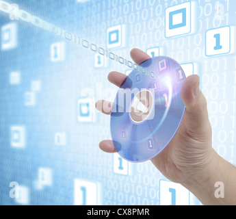 Hand holding a disc of digital media. Concept of information, storage, music and technologies. Stock Photo