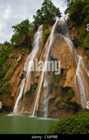 ANISAKAN FALLS drops into a green pool a few miles outside of PYIN U LWIN also known as MAYMYO - MYANMAR Stock Photo