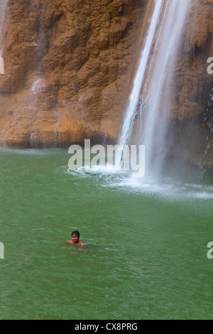 ANISAKAN FALLS drops into a green pool a few miles outside of PYIN U LWIN also known as MAYMYO - MYANMAR Stock Photo